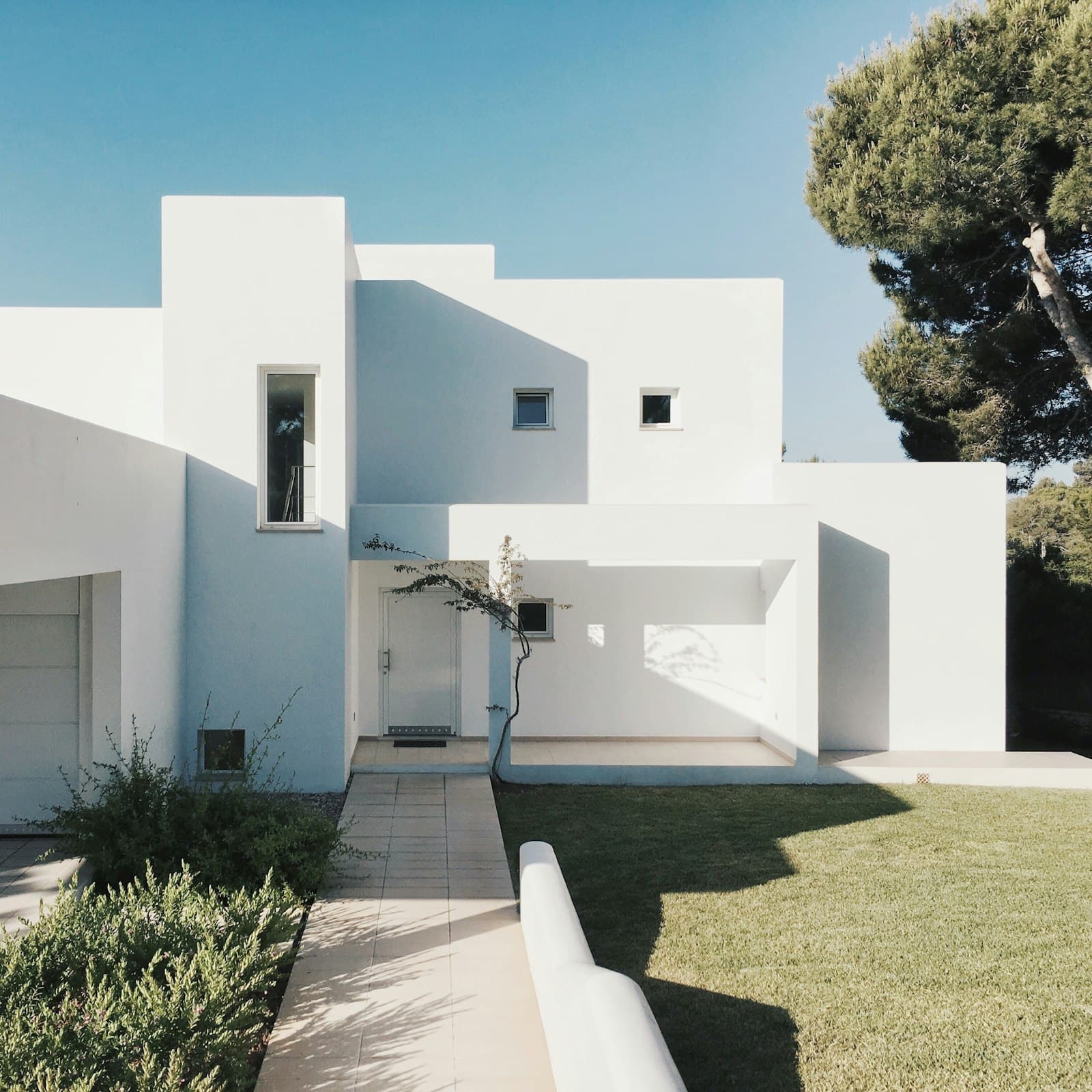 White house with a clean pitched roof
