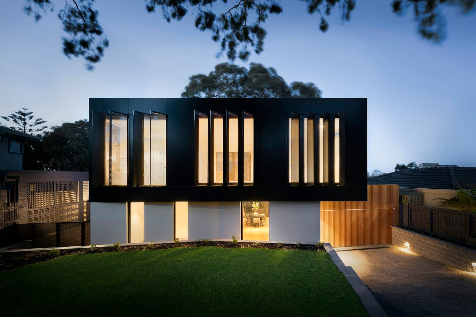 Modern living space with a high ceiling and windows